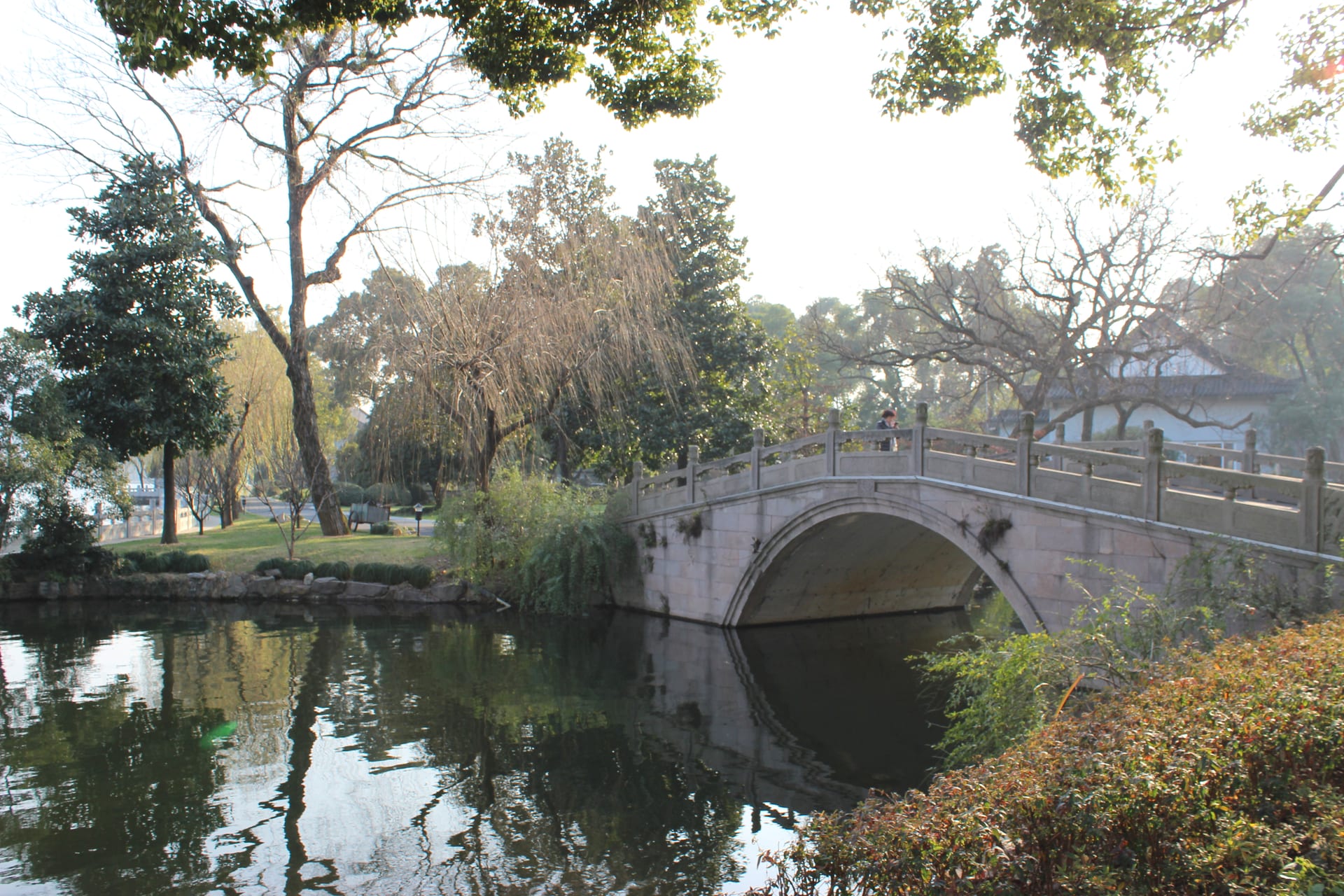 Garden bridge and water at West Lake State Guesthouse